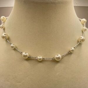 Silver tone white faux pearl station necklace. 16 inches with 2 1/2 inch extend.